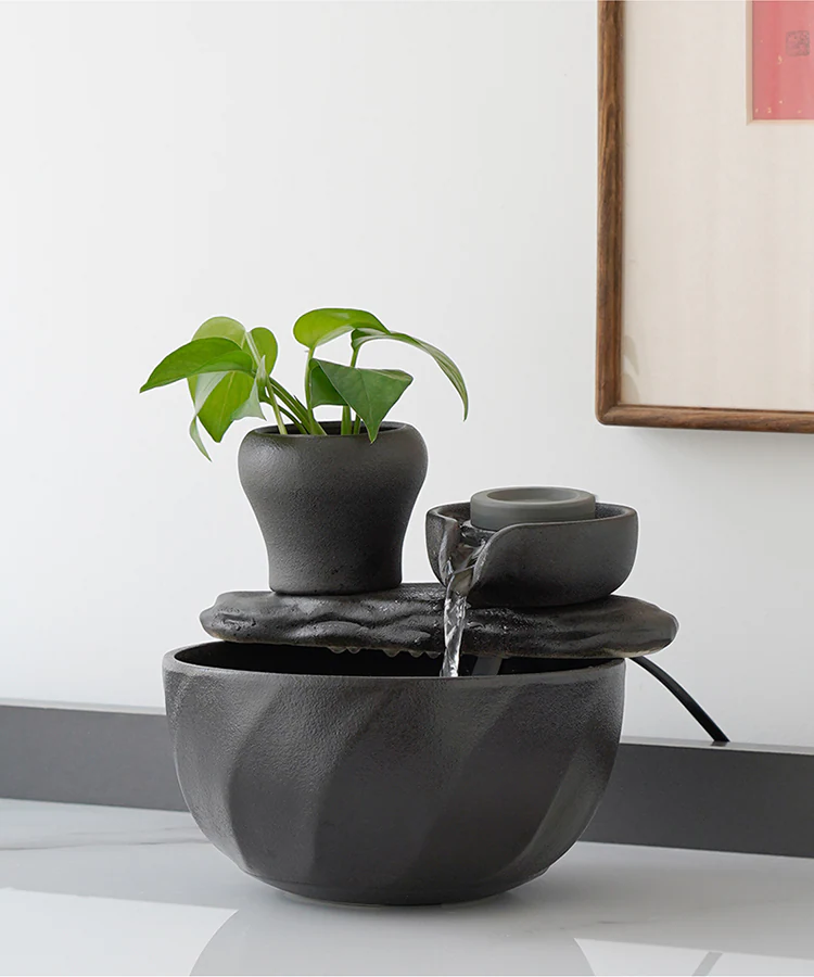 Ceramic fountain operating on a clean white interior surface