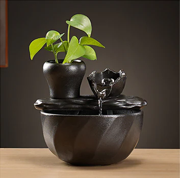 Tabletop fountain design with a sculpted lotus-style upper bowl