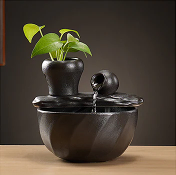Tabletop fountain design with a tilted pouring jar