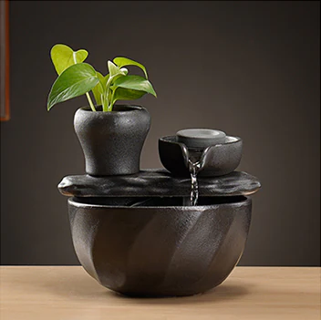 Tabletop fountain design with a round upper water bowl